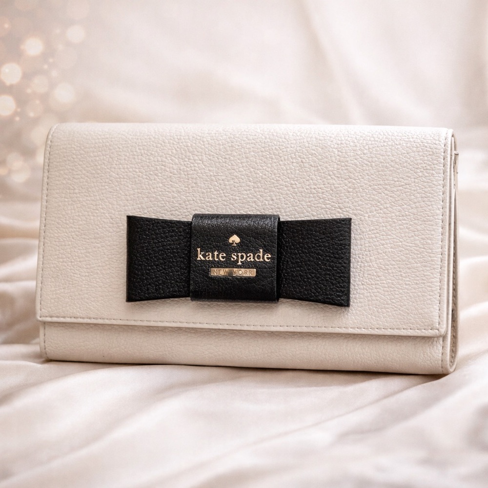 kate spade Cream Clutch With Black Bow